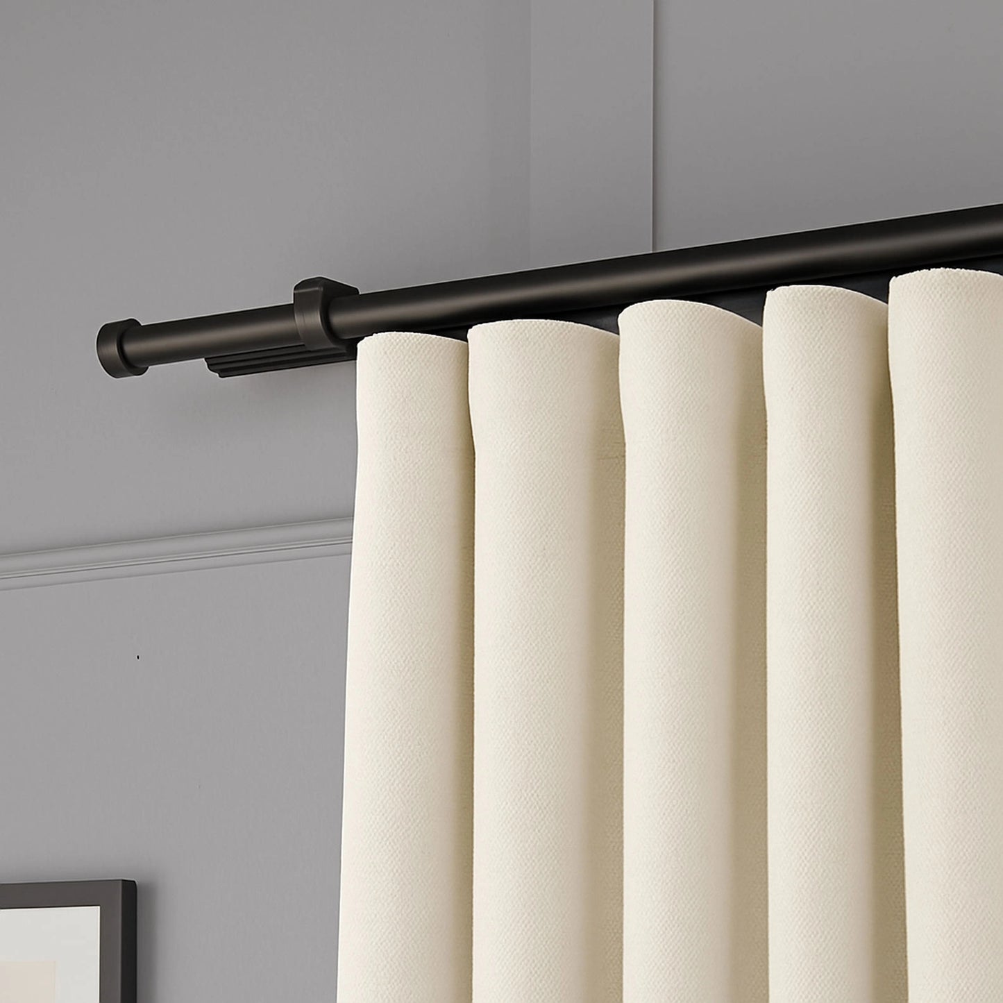 Side angle showing the fabric drape and thickness of 100% Blackout Pleated Linen Curtain Panels in Cream White.