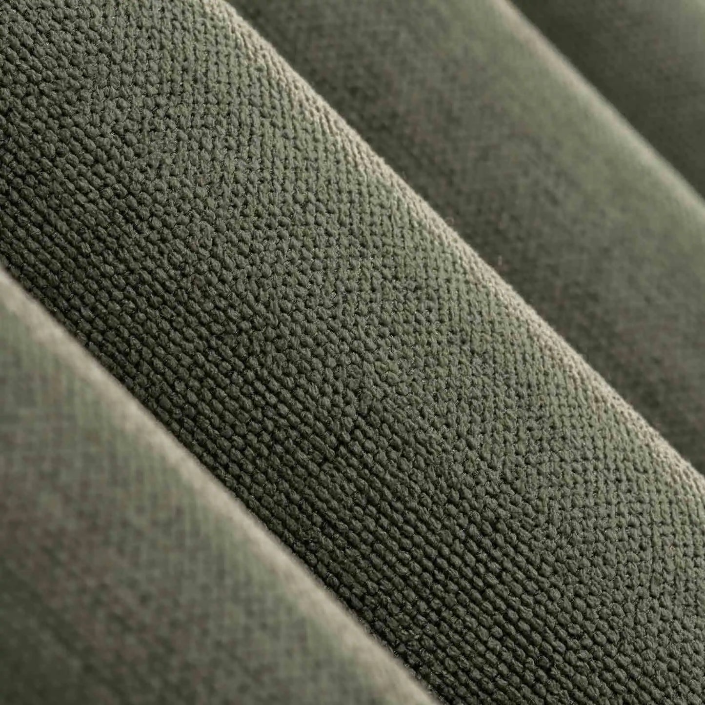 Close-up view of the linen texture and pleats of 100% Blackout Pleated Linen Curtain Panels in Olive Green.