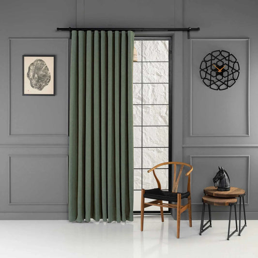 Full view of the curtain panels in a room setting of 100% Blackout Pleated Linen Curtain Panels in Matcha Green.