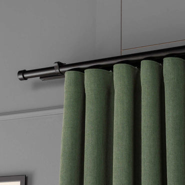 Top view showing the pleated header and curtain rod of 100% Blackout Pleated Linen Curtain Panels in Matcha Green.
