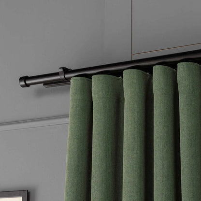 Top view showing the pleated header and curtain rod of 100% Blackout Pleated Linen Curtain Panels in Matcha Green.